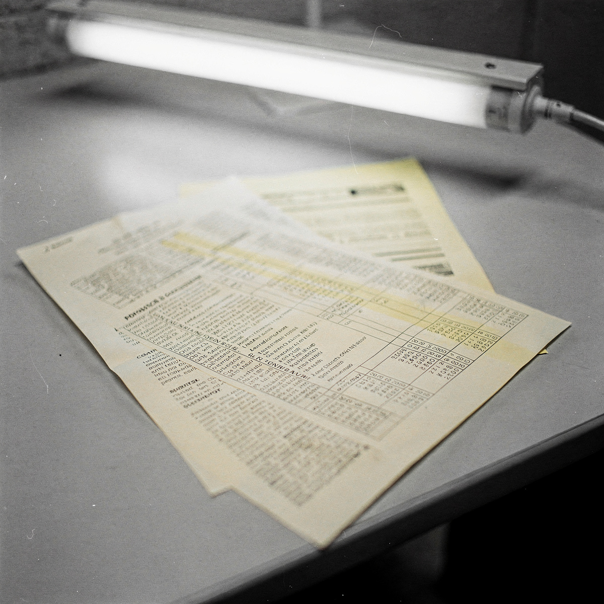 A legal document detailing financial penalties, resting on a generic office desk, under institutional lighting.
